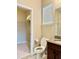 Small bathroom with toilet and granite vanity at 8426 Morehouse Dr, Orlando, FL 32836