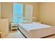 Bright bedroom with white furniture and window blinds at 8426 Morehouse Dr, Orlando, FL 32836