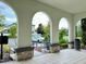 Covered porch with arched entryways and seating at 8426 Morehouse Dr, Orlando, FL 32836