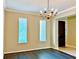 Formal dining room with hardwood floors and chandelier at 8426 Morehouse Dr, Orlando, FL 32836