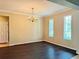 Spacious dining room with hardwood floors and natural light at 8426 Morehouse Dr, Orlando, FL 32836