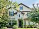 Two-story house with stone accents and a large front door at 8426 Morehouse Dr, Orlando, FL 32836