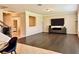 Gathering room with hardwood floors, staircase, and open concept design at 8426 Morehouse Dr, Orlando, FL 32836