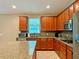 Spacious kitchen with wood cabinets, granite countertops, and stainless steel appliances at 8426 Morehouse Dr, Orlando, FL 32836