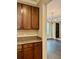 Kitchen features extra cabinetry and views into the living room at 8426 Morehouse Dr, Orlando, FL 32836