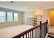 Bright loft bedroom with large windows and neutral decor at 8426 Morehouse Dr, Orlando, FL 32836