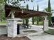 Covered picnic area with stone pillars and ample seating for residents at 8426 Morehouse Dr, Orlando, FL 32836