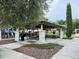 Community pavilion with picnic tables, shaded seating, and nearby playground at 8426 Morehouse Dr, Orlando, FL 32836