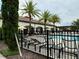 Community pool with lounge chairs and umbrellas at 8426 Morehouse Dr, Orlando, FL 32836
