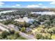 Aerial view showing the home's peaceful setting near a lake and other residences at 790 Silhouette Ct, Longwood, FL 32750