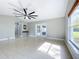 Spacious living room with tile floors and sliding glass doors at 790 Silhouette Ct, Longwood, FL 32750