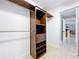 Walk-in closet with custom shelving and access to living area at 790 Silhouette Ct, Longwood, FL 32750