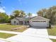 Newly built single-story home with a two-car garage and neat landscaping at 790 Silhouette Ct, Longwood, FL 32750