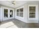 Screened porch with ceiling fan and french doors at 790 Silhouette Ct, Longwood, FL 32750