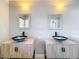 Modern bathroom with double sinks and unique vessel sinks at 790 Silhouette Ct, Longwood, FL 32750