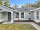 Newly renovated home with a modern front entrance and well-maintained landscaping at 790 Silhouette Ct, Longwood, FL 32750