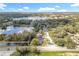 Aerial view of home near a large lake and neighborhood at 790 Silhouette Ct, Longwood, FL 32750