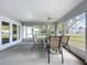 Relaxing screened porch with seating area and ceiling fan at 790 Silhouette Ct, Longwood, FL 32750