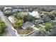 Aerial view of the home situated on a quiet street near a serene lake at 790 Silhouette Ct, Longwood, FL 32750
