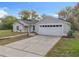 Newly renovated single-Gathering home with a two-car garage and landscaped lawn at 790 Silhouette Ct, Longwood, FL 32750