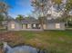 Single story home with a screened porch overlooking a tranquil waterway at 790 Silhouette Ct, Longwood, FL 32750