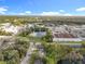 Aerial view of home near pond and shopping areas at 790 Silhouette Ct, Longwood, FL 32750