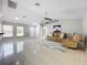 Spacious living room with tile floors, vaulted ceiling, and lots of natural light at 790 Silhouette Ct, Longwood, FL 32750