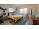 Spacious main bedroom with a comfortable bed and geometric wall art at 315 E St, Lake Wales, FL 33853