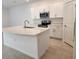 Modern kitchen with white cabinets and island at 3615 Davenport Creek Ct, Kissimmee, FL 34746