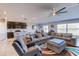 Spacious living room with sectional sofa, large TV, and ceiling fan at 168 Taft Dr, Davenport, FL 33837