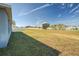 Spacious backyard with grassy area and partial fence at 168 Taft Dr, Davenport, FL 33837