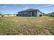 Single story house with grassy backyard at 168 Taft Dr, Davenport, FL 33837