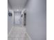 Clean hallway with tile flooring and neutral wall colors at 168 Taft Dr, Davenport, FL 33837