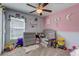 Adorable Bedroom with crib, changing table, and toys at 168 Taft Dr, Davenport, FL 33837