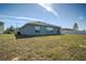 House exterior and backyard view, showing a large grassy area at 168 Taft Dr, Davenport, FL 33837