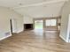 Spacious living room with vaulted ceilings, fireplace and new flooring at 6225 Centennial Dr, Orlando, FL 32808