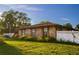 Brick home with a large yard and white fence at 1159 Collins Ave, Orange City, FL 32763