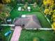 Single-story home with a large backyard and outbuildings at 1159 Collins Ave, Orange City, FL 32763