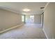 Main bedroom with carpet flooring and bathroom access at 106 Orange Dr, Sanford, FL 32773