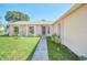 Brick house with a walkway, landscaping and a door at 2204 Clementine Trl, Clermont, FL 34714