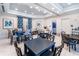 Casual breakfast area with multiple tables and chairs at 2071 Limestone Trl, Kissimmee, FL 34747