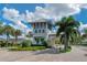 Gated entrance to the community with palm trees and landscaping at 2071 Limestone Trl, Kissimmee, FL 34747