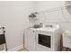 Laundry room with washer, dryer, and ample shelving at 2071 Limestone Trl, Kissimmee, FL 34747
