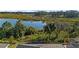 Stunning view of a serene lake and lush landscape at 2071 Limestone Trl, Kissimmee, FL 34747