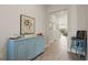 Spacious entryway featuring a light blue console table and framed artwork at 2071 Limestone Trl, Kissimmee, FL 34747