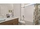 Clean bathroom with a tub, shower, and modern vanity at 2071 Limestone Trl, Kissimmee, FL 34747