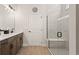 Elegant bathroom with double vanity, large shower, and modern fixtures at 2071 Limestone Trl, Kissimmee, FL 34747