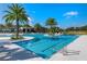 Resort-style pool with palm trees and lounge chairs at 2071 Limestone Trl, Kissimmee, FL 34747