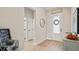 Bright and airy entryway with hardwood floors and autumn decor at 2071 Limestone Trl, Kissimmee, FL 34747