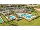 Resort-style pools surrounded by lush landscaping and palm trees at 2071 Limestone Trl, Kissimmee, FL 34747